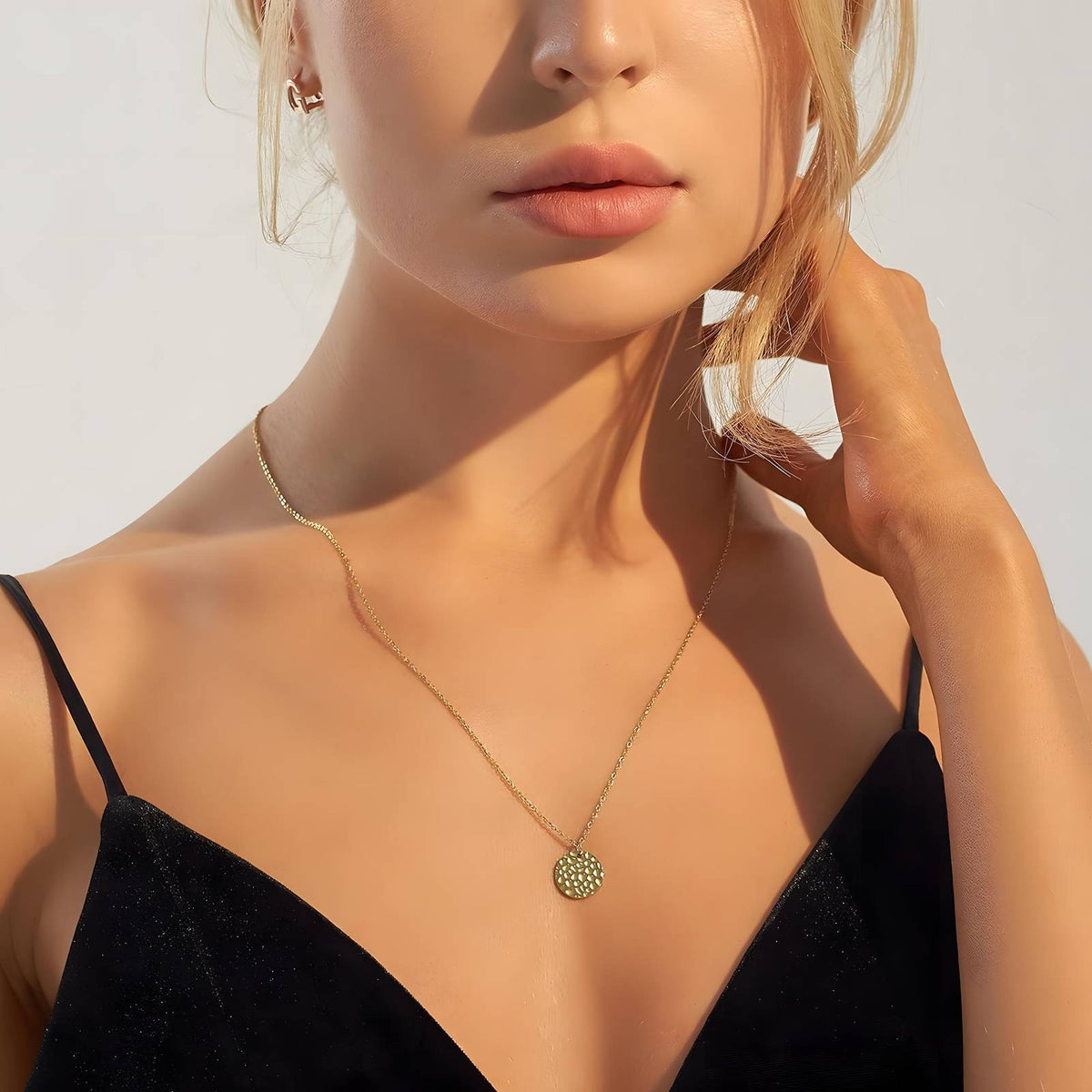 Nyaara hammered disc gold necklace styled for everyday wear