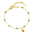 Gold bracelet with green beads and a shell charm on a white background
