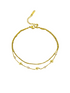 Gold bracelet with chain and star design on a white background