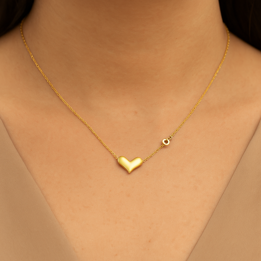 Heart-shaped gold-plated necklace on model’s neck – waterproof and tarnish-free from Nyaara
