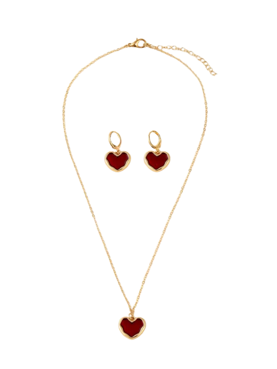 Jewelry set with heart-shaped pendants on a gold chain and earrings.