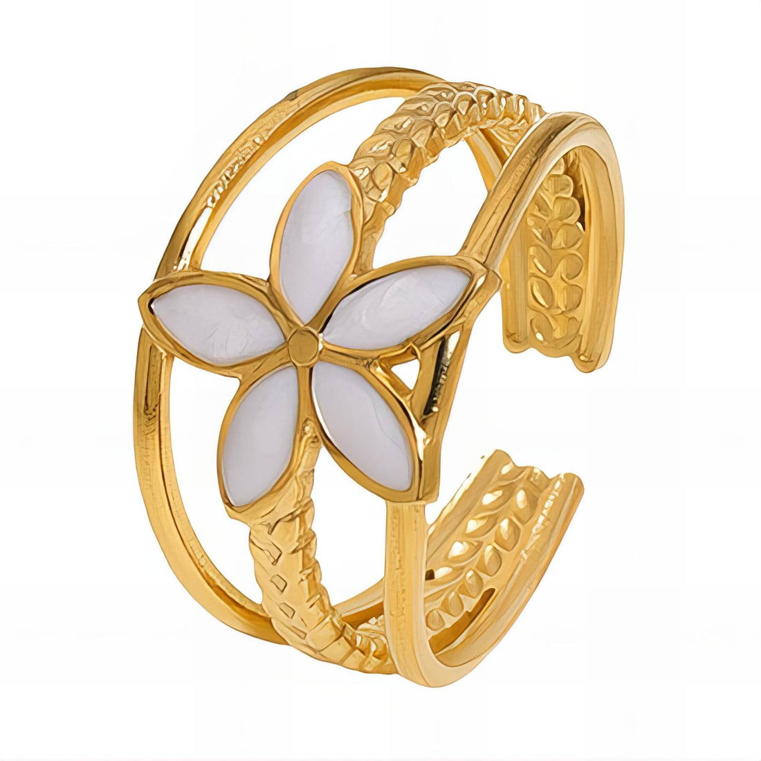 Layered gold floral ring with five-petal white enamel flower centerpiece and intricate textured open band