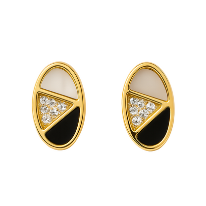 Pair of gold earrings with black and white design on a white background