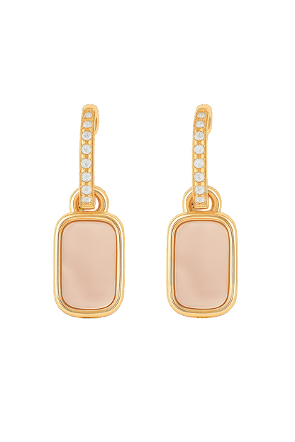 Gold earrings with pink stones on a white background