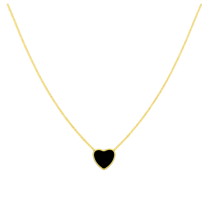Gold necklace with a black heart pendant on a white background